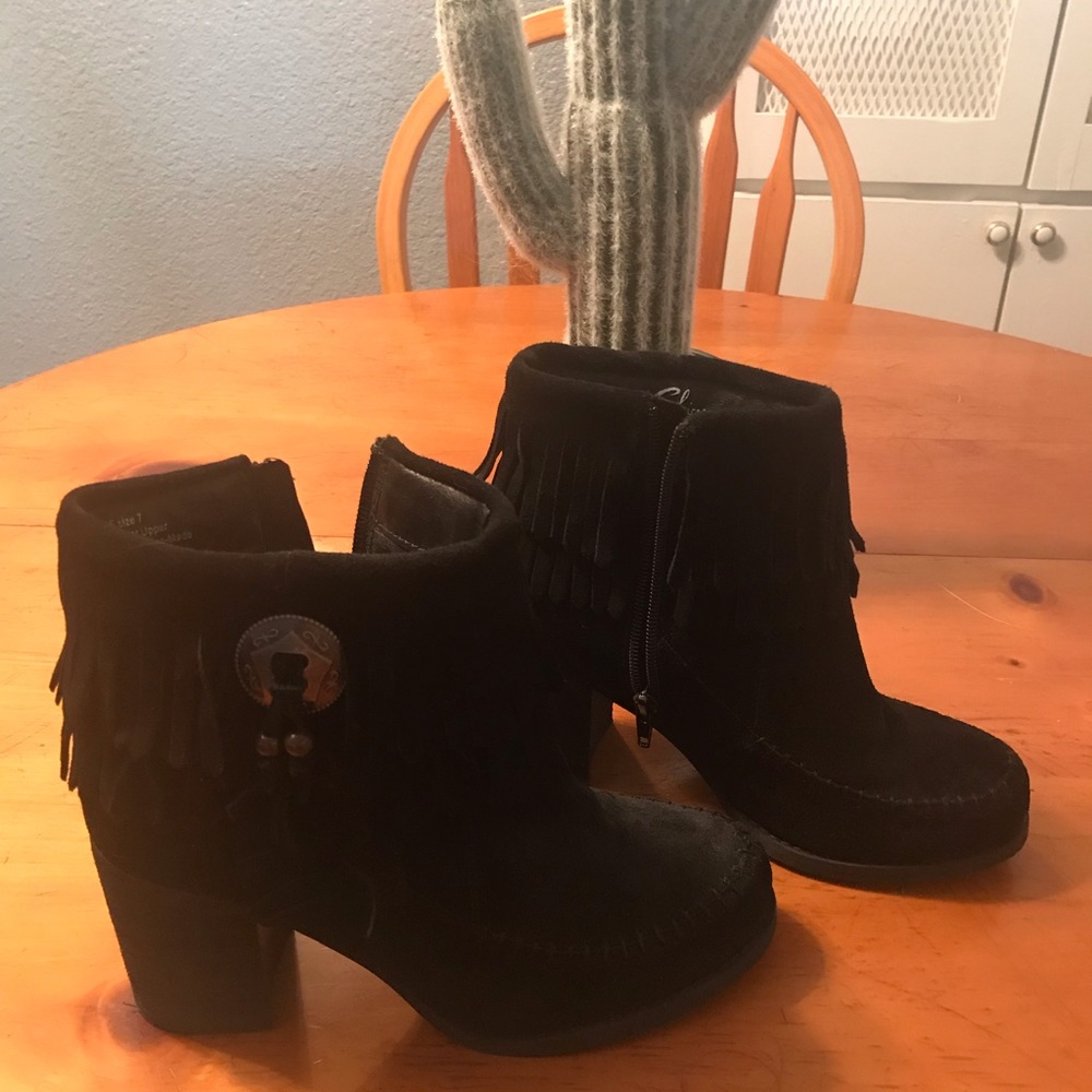 Black suede ankle boots w/ fringe.